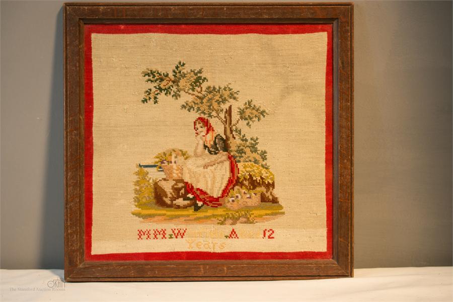 A needlework tapestry panel.
