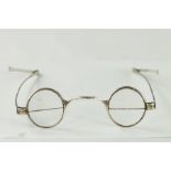 A rare pair of silver bifocals comprised of two semi-circular lenses mounted in each eye rim, with