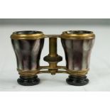 A pair of French opera glasses, in mother of pearl, the case labelled Da Fontaine Opticien Palais,