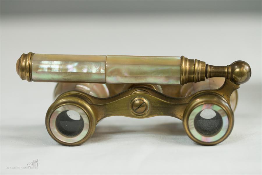 A pair of French opera glasses, in mother of pearl, with original case.