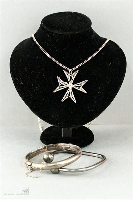 A silver bangle and a silver torc bracelet and a silver filigree cross pendant, 1.63toz