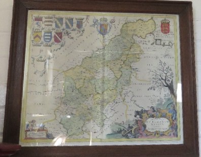 Four map prints, depicting Northamptonshire, Bedfordshire, Devonshire, and Huntingdonshire, each