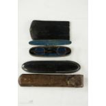 A 19th century papier mache black lacquered frog mouth case, leather case, steel oval case with