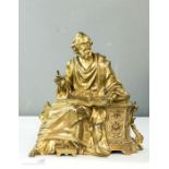 A gilt bronze statue of scholar reading Lois D'Athens, 23cm high.