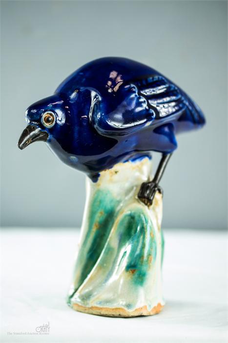 An unusual 19th century blue glazed stoneware bird, raised on a green glazed base. - Image 2 of 2