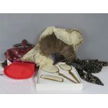 A quantity of vintage clothing including handbag, ostrich feather fan, lace wedding veil etc.