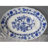 A blue and white oval meat platter.