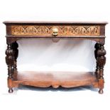 A 17th century oak style reproduction sideboard with lunette carved drawer, cup and cover legs,