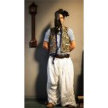 A Moroccan outfit, North Frontier, comprising trousers, waistcoat, leather shoes, turban, and rush