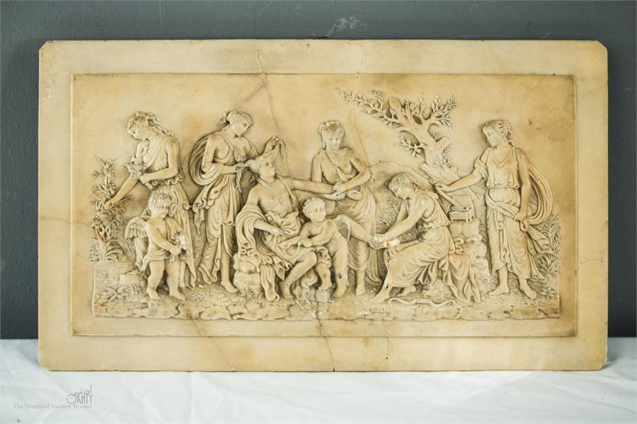 A plaque carved with a classical scene with putti, possibly made from coral. - Image 2 of 3