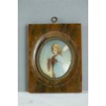 A Victorian miniature portrait of a woman, oil on ivory, with tortoiseshell frame, 5 by 4cm.