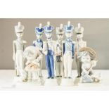 A quantity of German porcelain figures and soldiers.