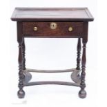 An 18th century oak dish top table, with single drawer, turned legs and shaped peripheral
