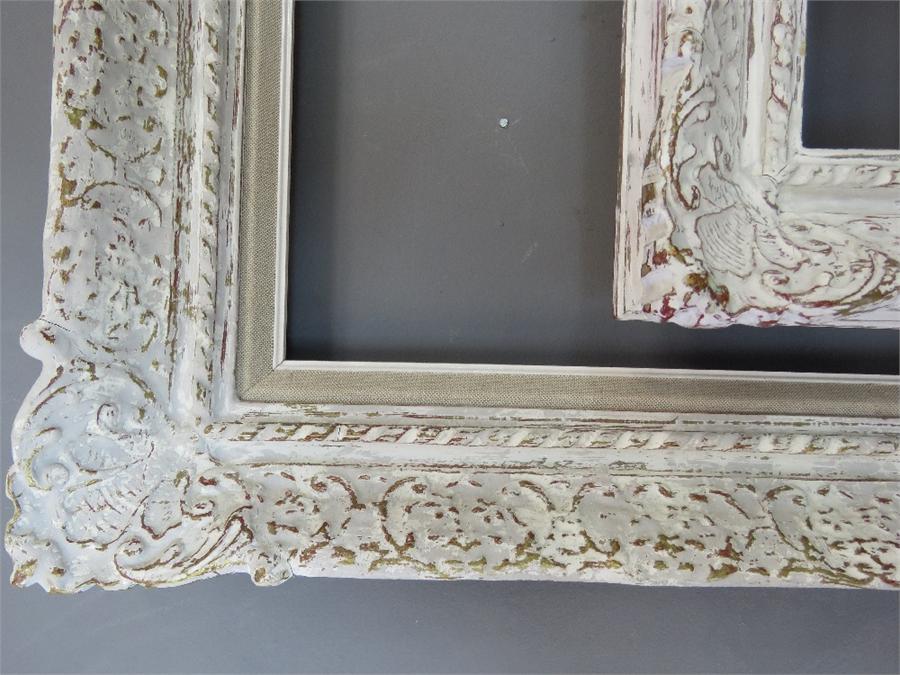 A group of four white painted carved frames of various size. - Image 3 of 3