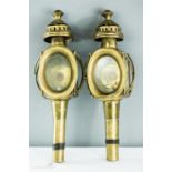 A pair of brass carriage lanterns with brackets.