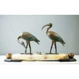 A bronze group; a pair of cranes and a snail raised on an agate base.