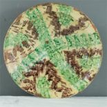 A 19th century green and brown slip-glazed stoneware bowl.