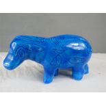 A blue glazed hippopotamus bearing heiroglyphs 9½ by 20cm.