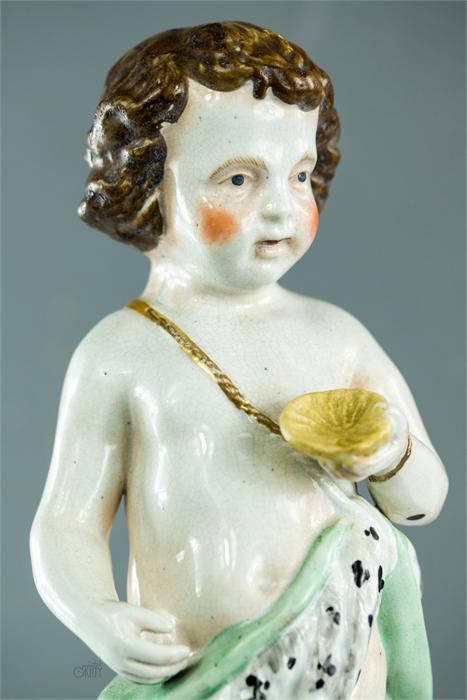 A 19th century putto holding a scallop shell. - Image 2 of 3