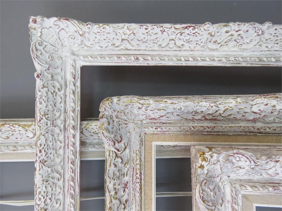 A group of four white painted carved frames of various size. - Image 2 of 3