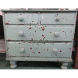 A small painted pine chest of drawers.