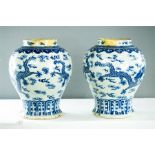 A pair of Chinese blue and white vases. (A/F)