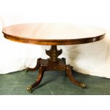 A fine Regency rosewood boulework breakfast table, with circular tilt top raised on a platform