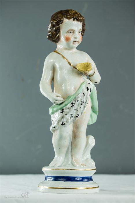 A 19th century putto holding a scallop shell.