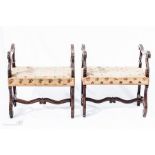 A pair of early 19th century mahogany stools with acanthus carved frames, and tapestry upholstered