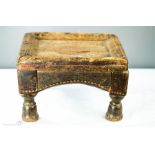 An African carved stool.