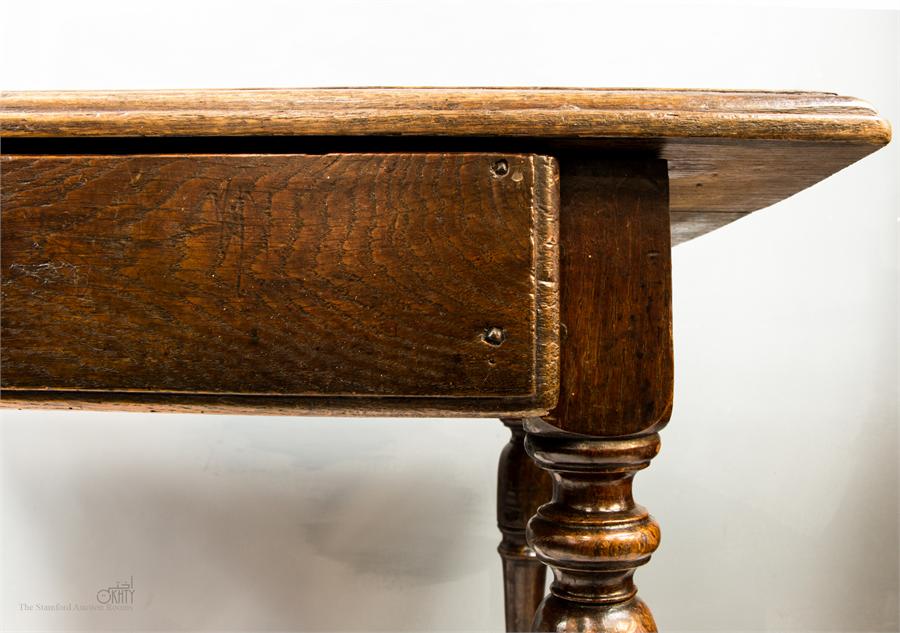 A 17th century oak side table with a single drawer, turned legs, and H-form stretcher, 66 by 88 by - Image 3 of 3