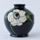 A small Moorcroft vase, baluster form, dated 2009 to the base, impressed to base, signed with