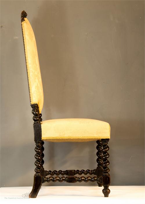 An 18th century Spanish walnut high back chair, with two lion head carved finials, the shaped back - Image 4 of 4