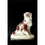 A 19th century Staffordshire Spaniel, 13cm high.