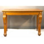 A late Regency oak console table, carved legs, with secret drawer to the side, 82 by 129 by 86cm.