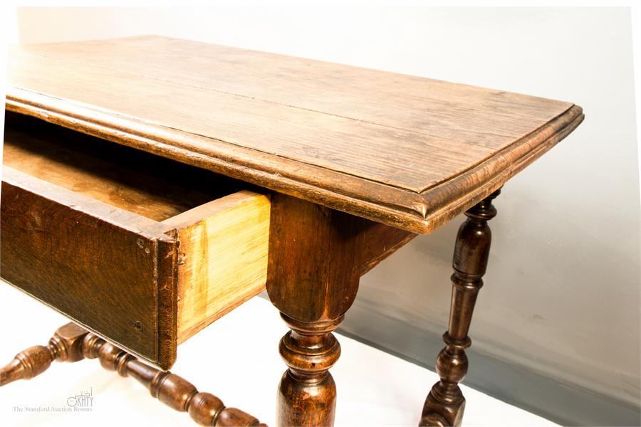 A 17th century oak side table with a single drawer, turned legs, and H-form stretcher, 66 by 88 by - Image 2 of 3