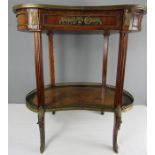 A French burr satinwood veneered kidney table with gilt metal mounts.
