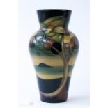 A Moorcroft vase initialled KW, CH, to the base and dated 2006, 21cm high.