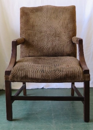 A 19th century gentlemans open armchair, with mahogany frame and shaped back.