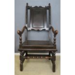 A late 18th century oak chair with spindles.