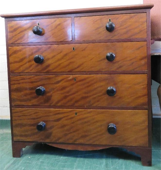 A Victorian mahogany chest of drawers with two short over three long graduated drawers and turned