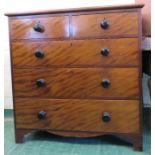 A Victorian mahogany chest of drawers with two short over three long graduated drawers and turned