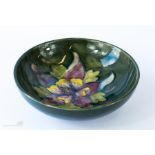 A Moorcroft bowl, anemone pattern, 14½cm diameter.