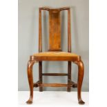 An 18th century walnut single chair with drop in tapestry seat.