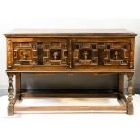 A 17th century and later dresser base with geometric moulded drawers, turned legs and peripheral