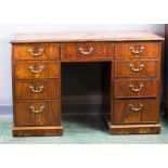 A mahogany Chippendale period pedestal desk, with leather top.