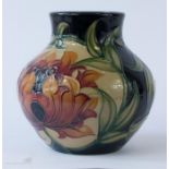 A Moorcroft vase, signed to the base CH and dated 2005, 13cm high.