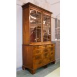 A Chippendale period mahogany bookcase, with astrigal glazed doors enclosing height adjustable