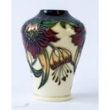 A Moorcroft Anna Lily vase, 10cm high. [Moorcroft designer Nicola Slaney introduced Anna Lily in