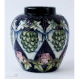 A Moorcroft vase, initialled to the base DW, 2003, grape and vine, 14cm high.